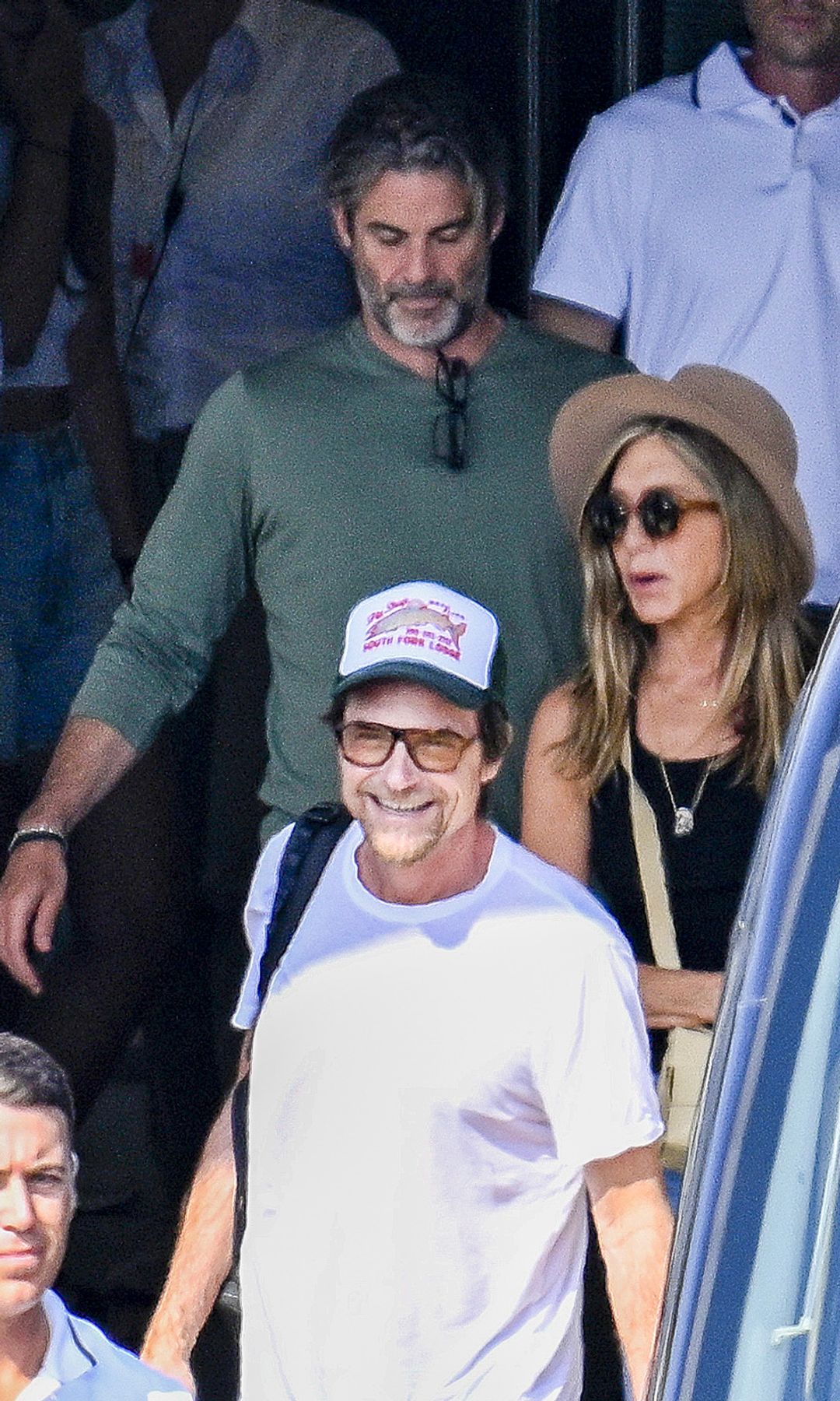 Jennifer Aniston was spotted in Palma de Mallorca with Jim Curtis, the life coach she traveled with, adding fuel to romance rumours.