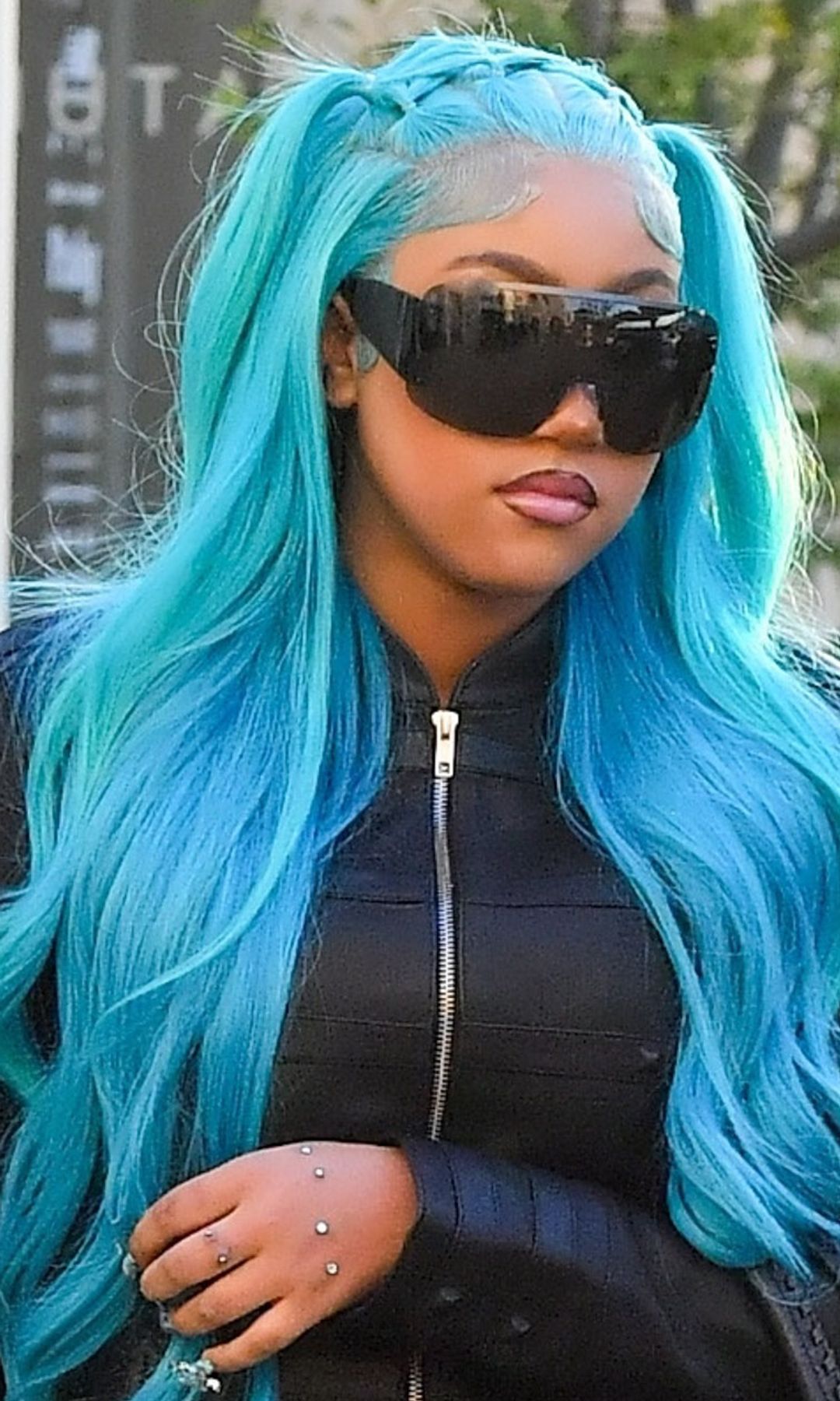 North West rocks an all-leather look, hand piercings and signature blue hair in Los Angeles