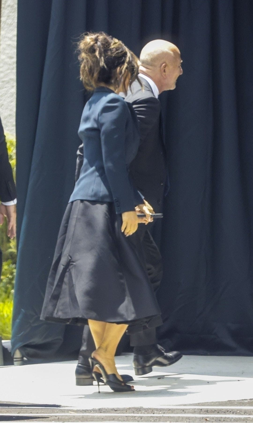 The couple held hands as they entered the private funeral service