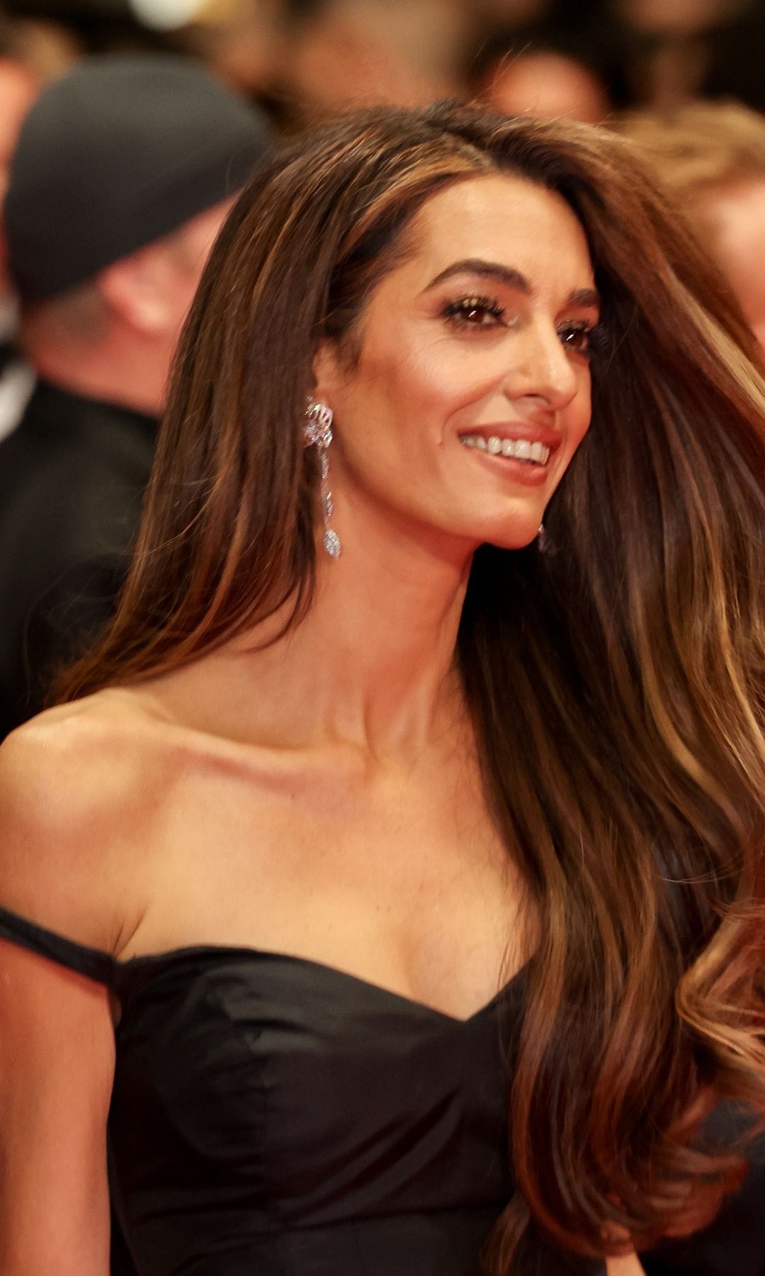 Amal Clooney wears chic black skirt suit with lace cutout for palace visit