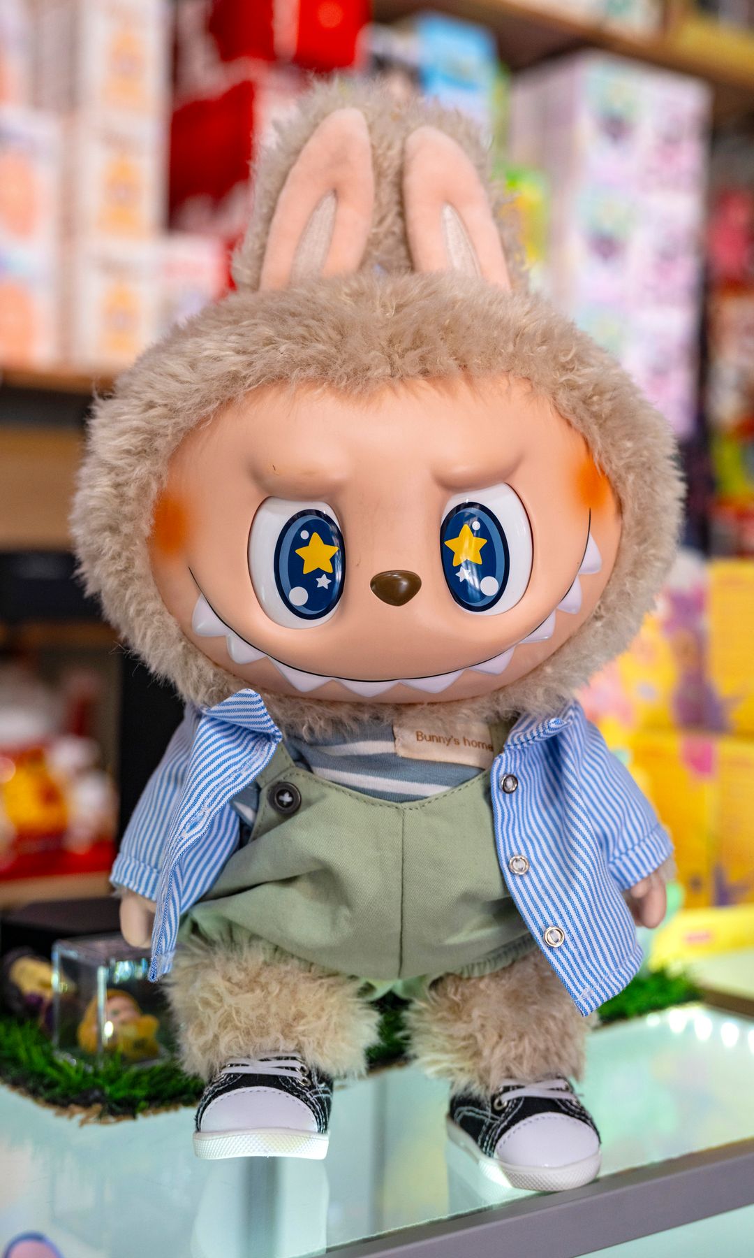 A large Labubu sits on the counter at The Labu'Tique Shop in Anaheim 