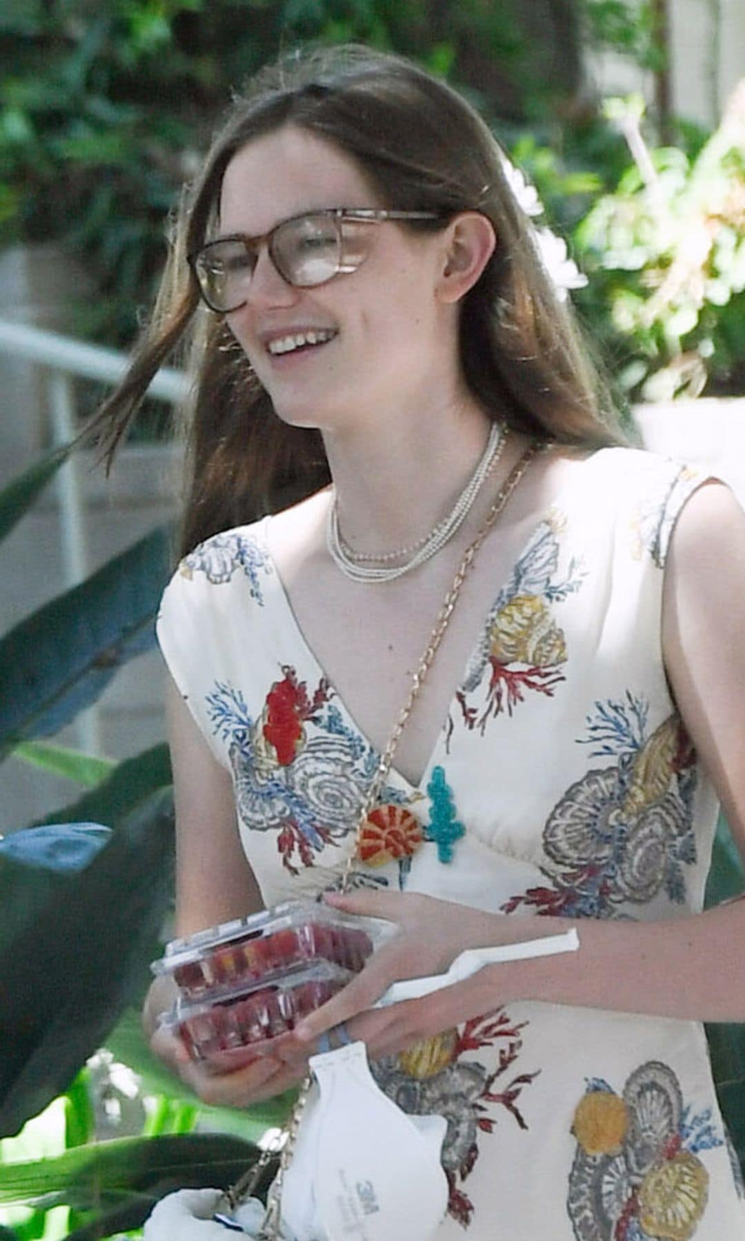 Violet wore a long dress with some florals printed on it