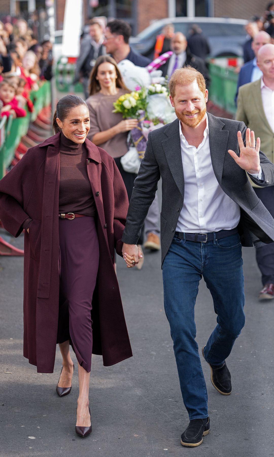NOTTINGHAM, ENGLAND - OCTOBER 15: Meghan, Duchess of Sussex and Prince Harry, Duke of Sussex greet well-wishers as they arrive at the Community Recording Studio (CRS).