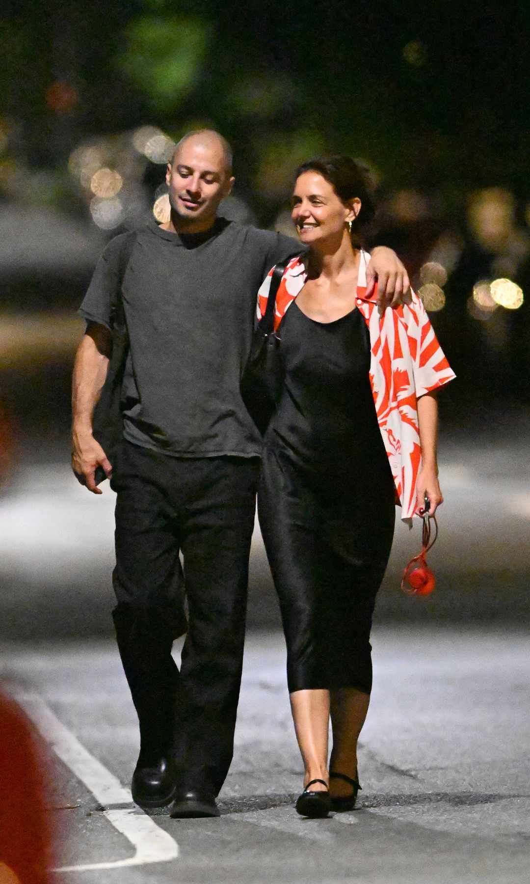 Katie Holmes and Jason Bard Yarmosky smiling and being affectionate while out for dinner in New York City.