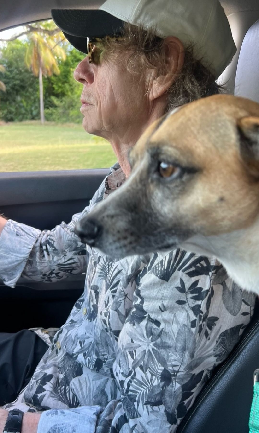 Jagger driving alongside their dog