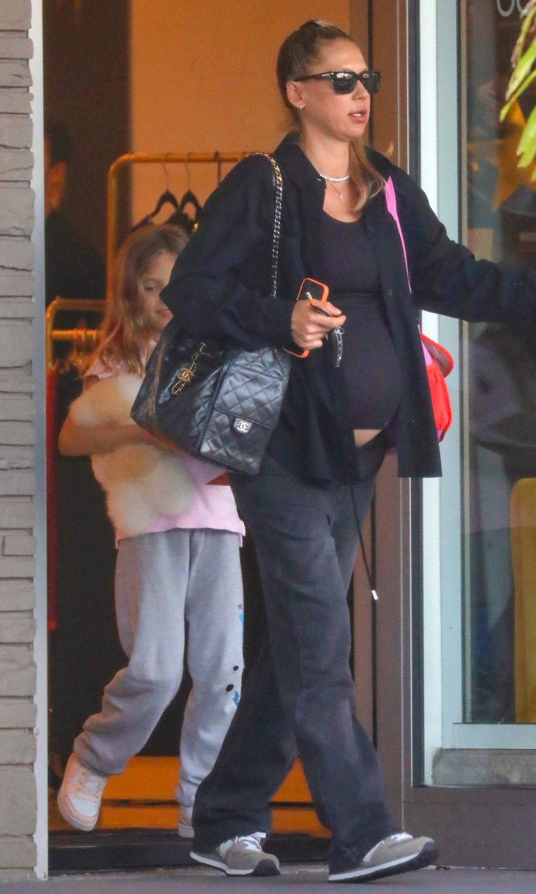 Kournikova wore a tight black t-shirt that showed off her pregnancy