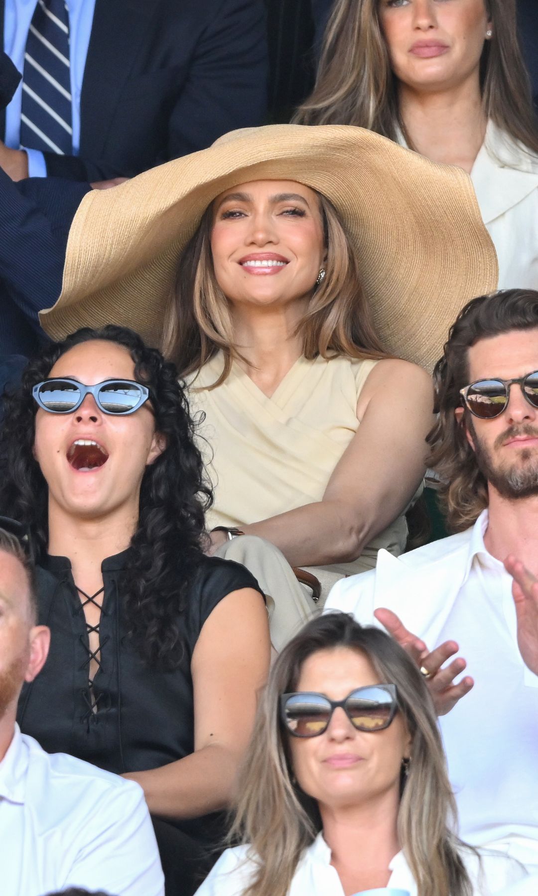 Jennifer Lopez becomes the center of attention with a wide-brim hat in a sea of sunglasses