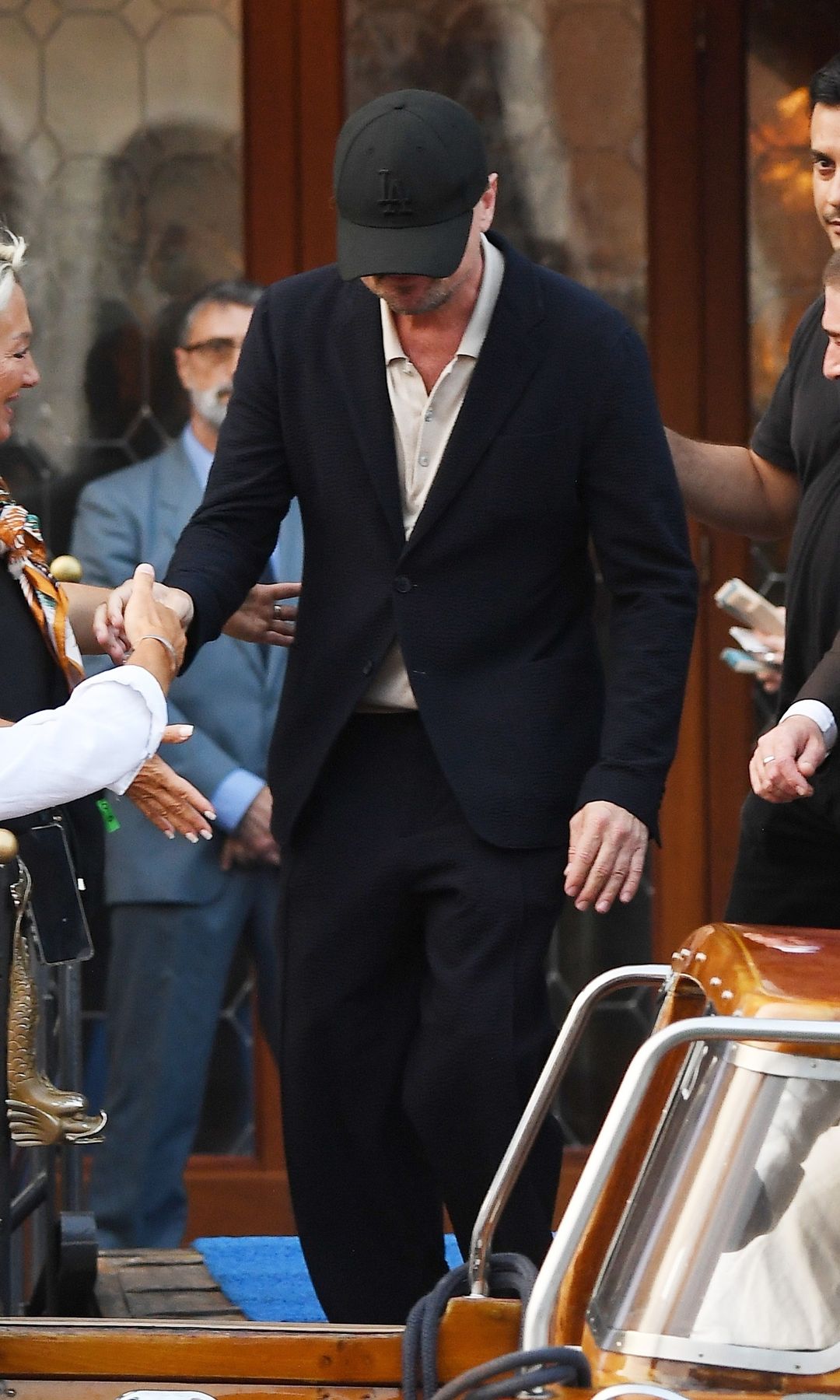 DiCaprio wore a black cap to shield his face from the camera