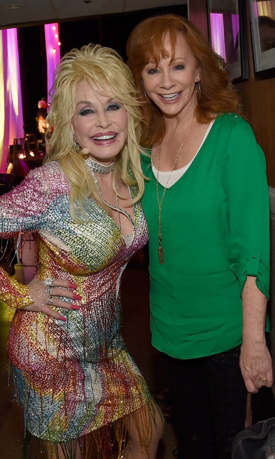 Reba McEntire visits Dolly Parton backstage during Dolly Parton: Pure & Simple Benefiting The Opry Trust Fund at Ryman Auditorium in 2015