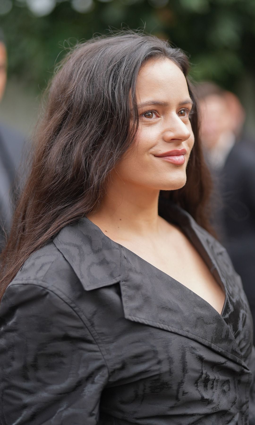 Rosalía turns heads in daring faux-plunge top and sleek high-slit skirt in Paris