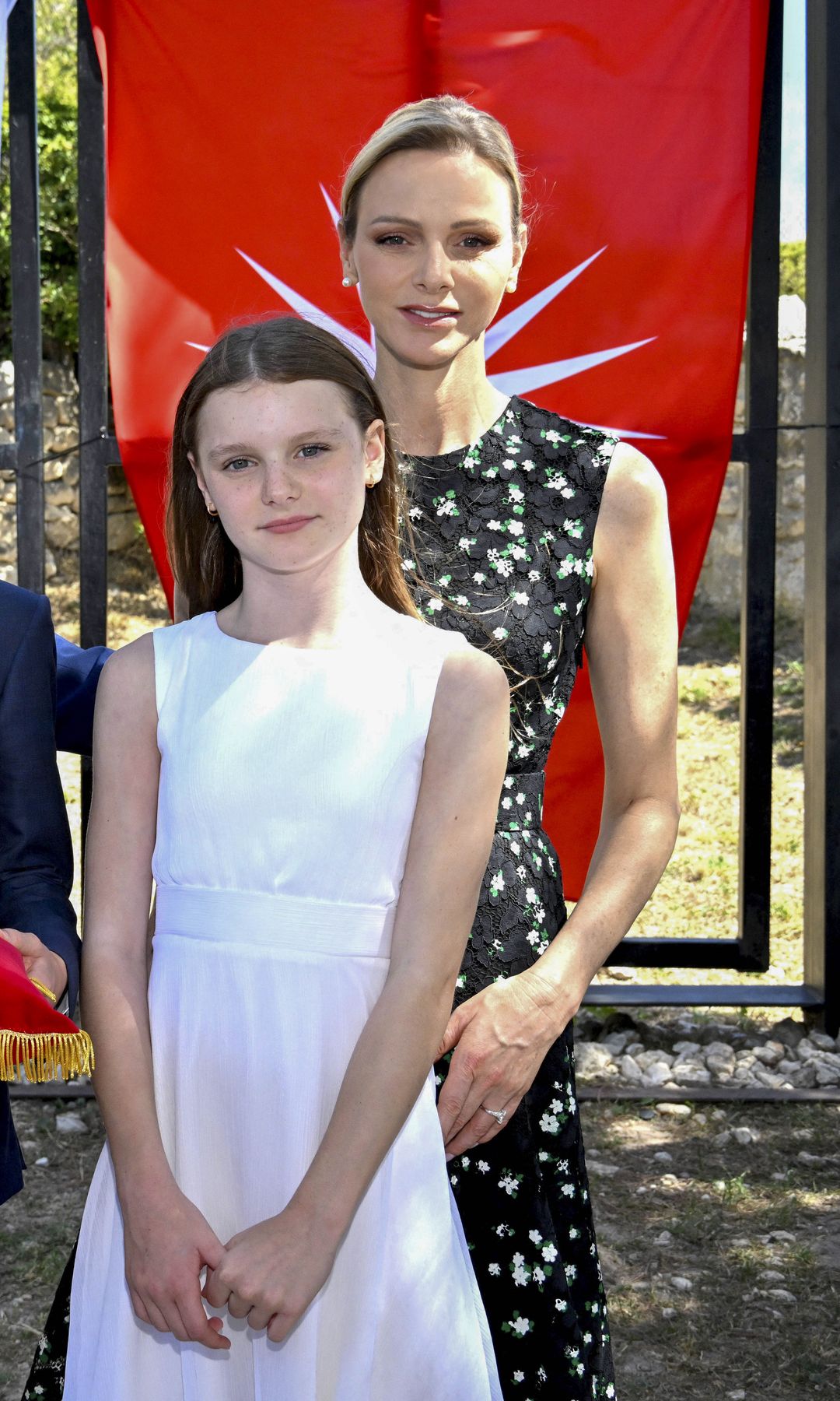 Princess Charlene steps out with her family in a black dress reminiscent of one Queen Letizia wore a decade ago