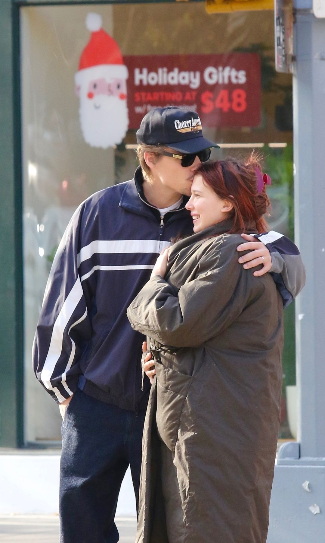 The couple shared a sweet kiss as they waited to cross the street