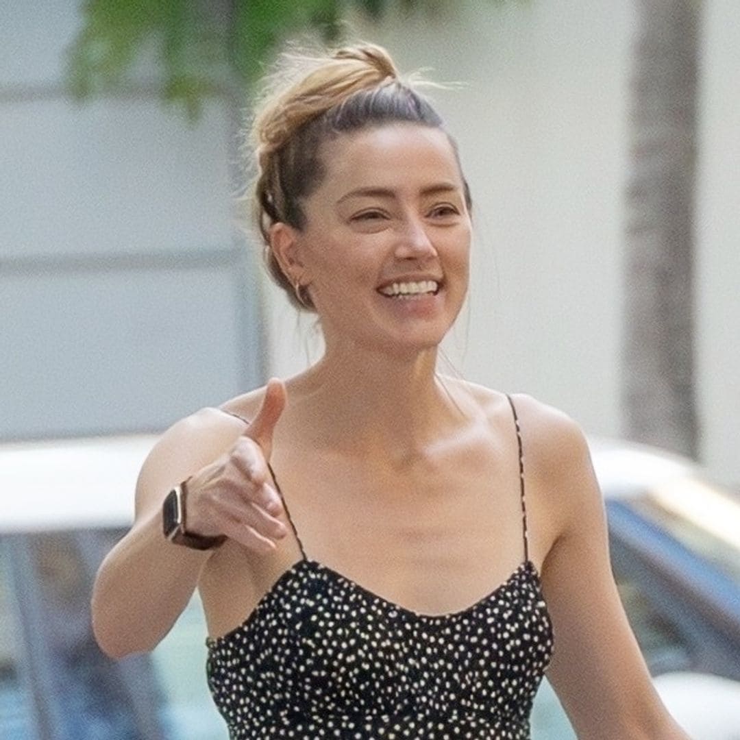 Amber Heard laughs and embraces life in Madrid after US trip