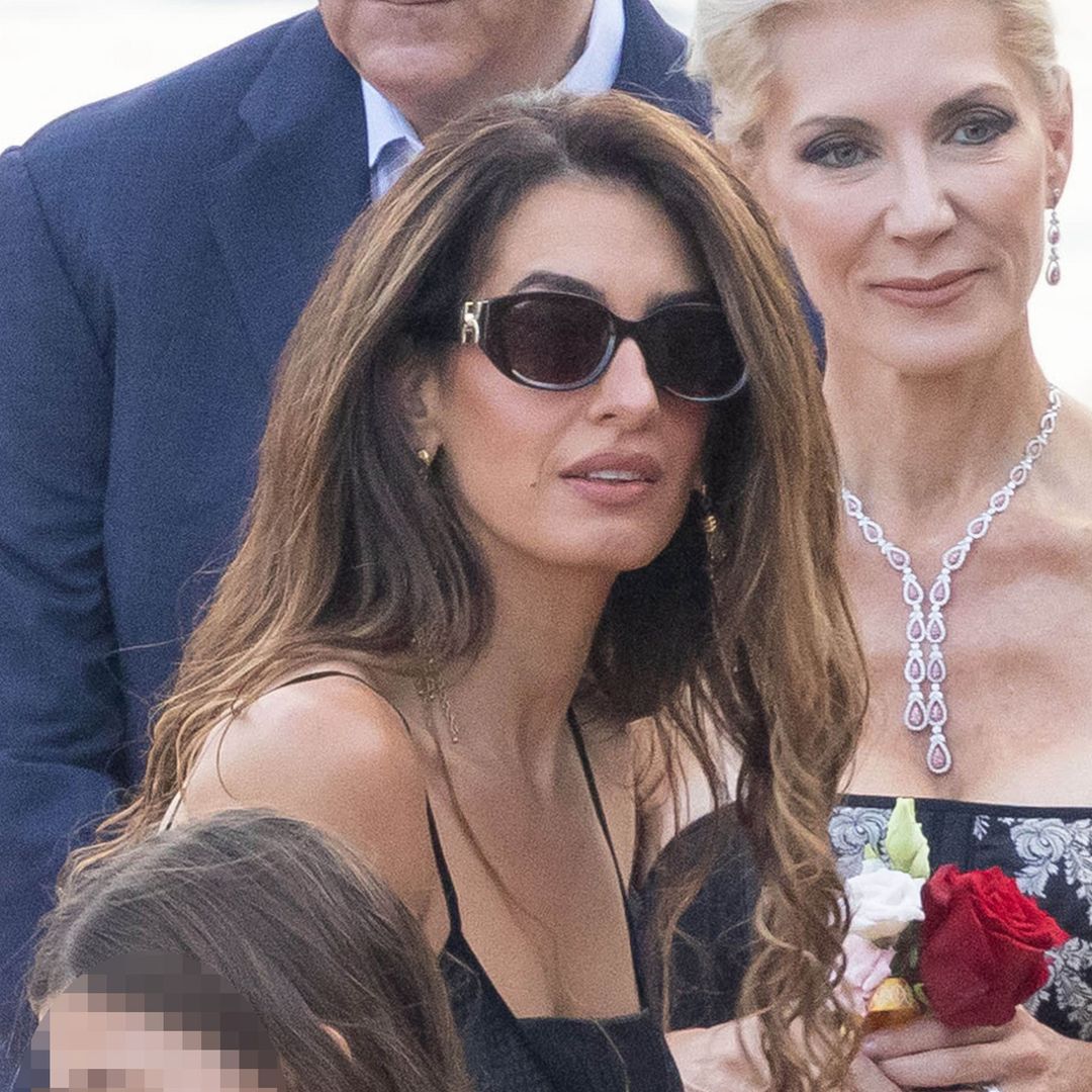 George and Amal Clooney make a rare appearance with twins Ella and Alexander as Amal stuns in elegant black dress