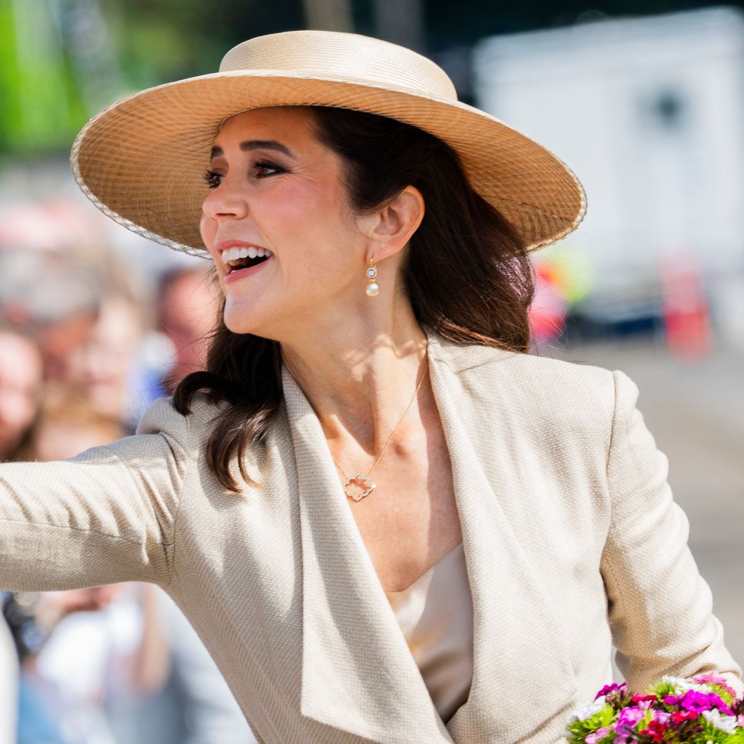 Queen Mary turns a silk scarf and a single rose into the ultimate royal beauty statement