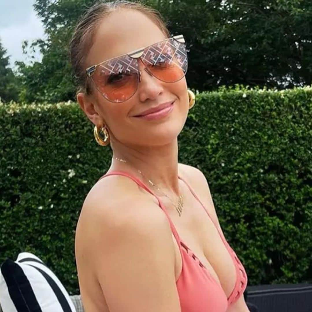 Jennifer Lopez relaxes poolside and shows off toned figure in pink swimsuit