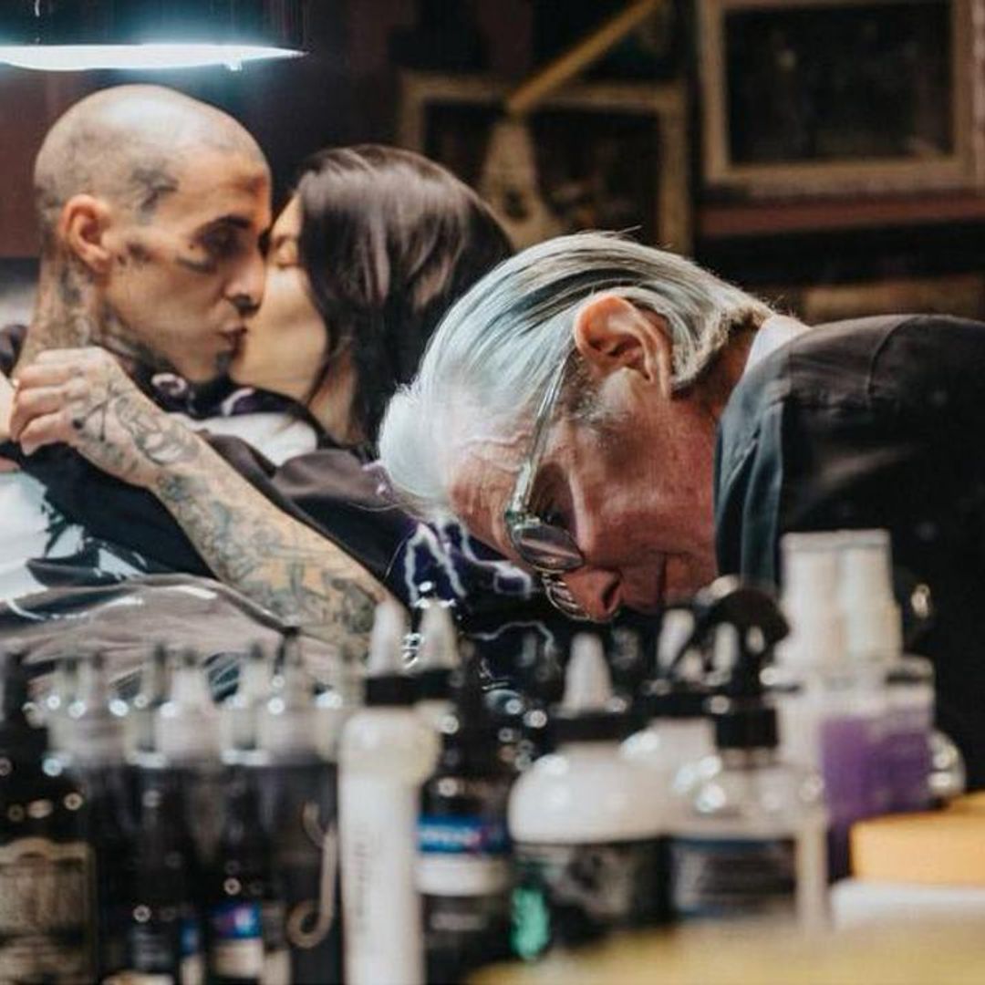 Kourtney Kardashian comforts Travis Barker as he gets a tattoo honoring late Foo Fighters drummer Taylor Hawkins