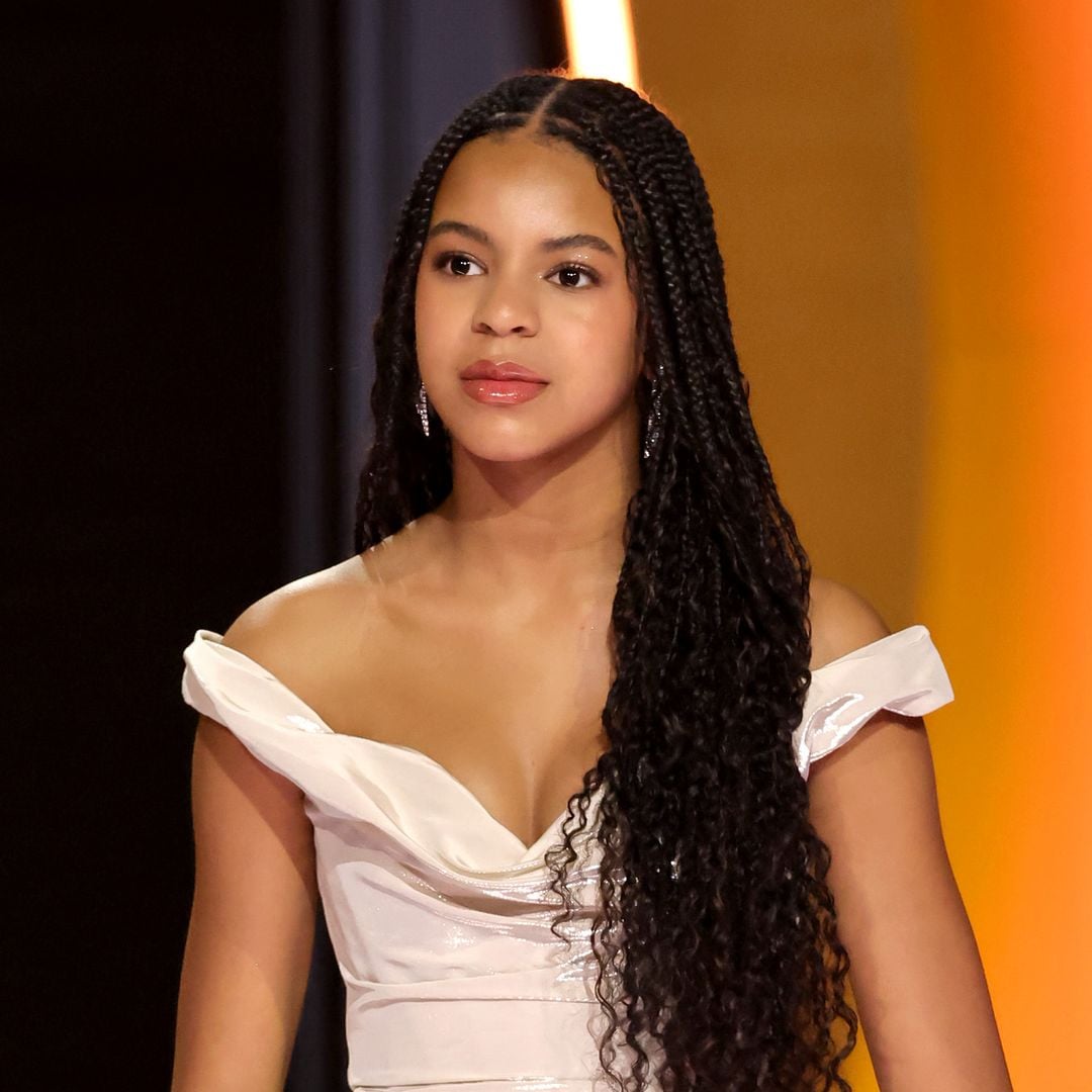 Blue Ivy towers over Beyoncé in green pleated skirt and statement jewelry during fun night out