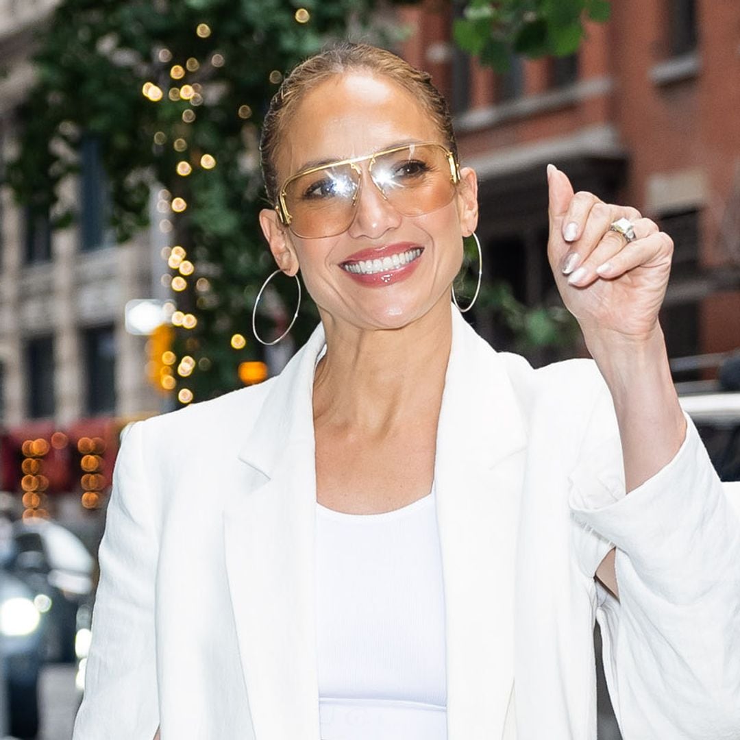 Jennifer Lopez is all smiles in NYC wearing white crop top and wedge platforms