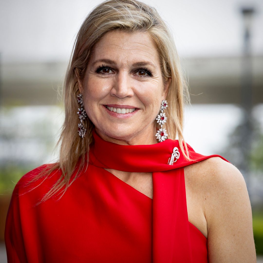 Queen Máxima embraces polished feminine silhouette in bold yellow ensemble with luminous beauty look