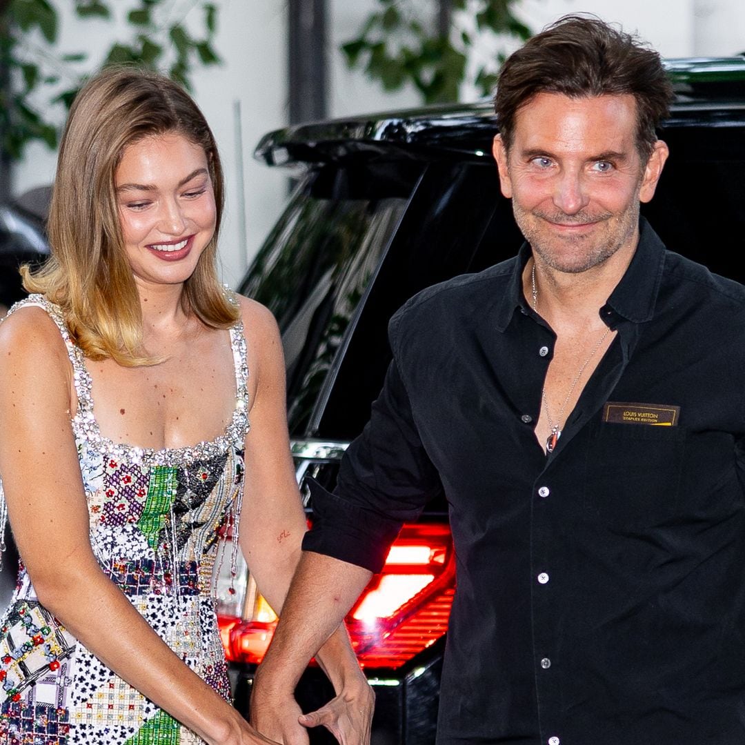 Bradley Cooper and Gigi Hadid hold hands as they leave Broadway date