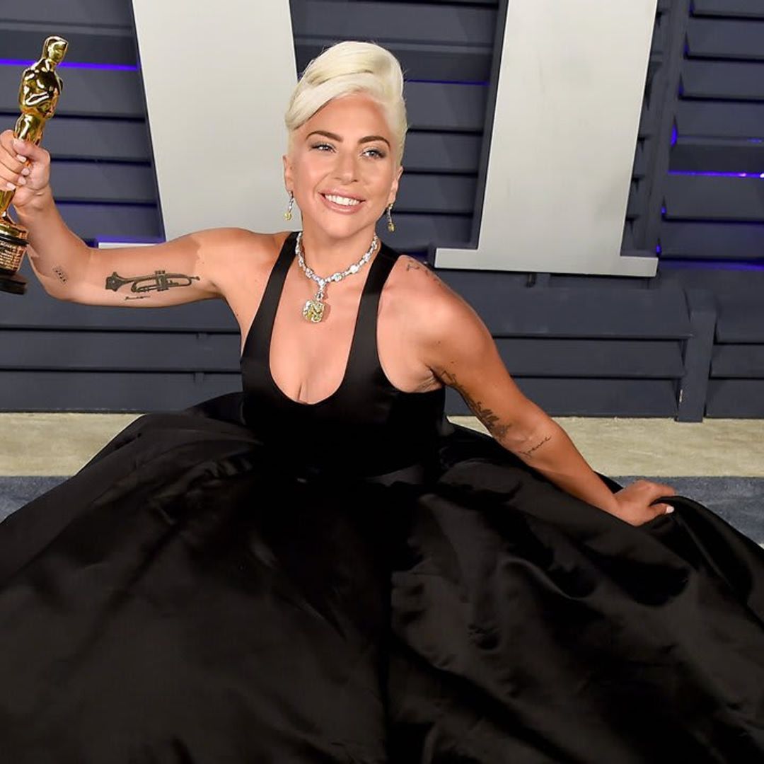 Lady Gaga looked like a boss strutting in a boa made up of $100 bills