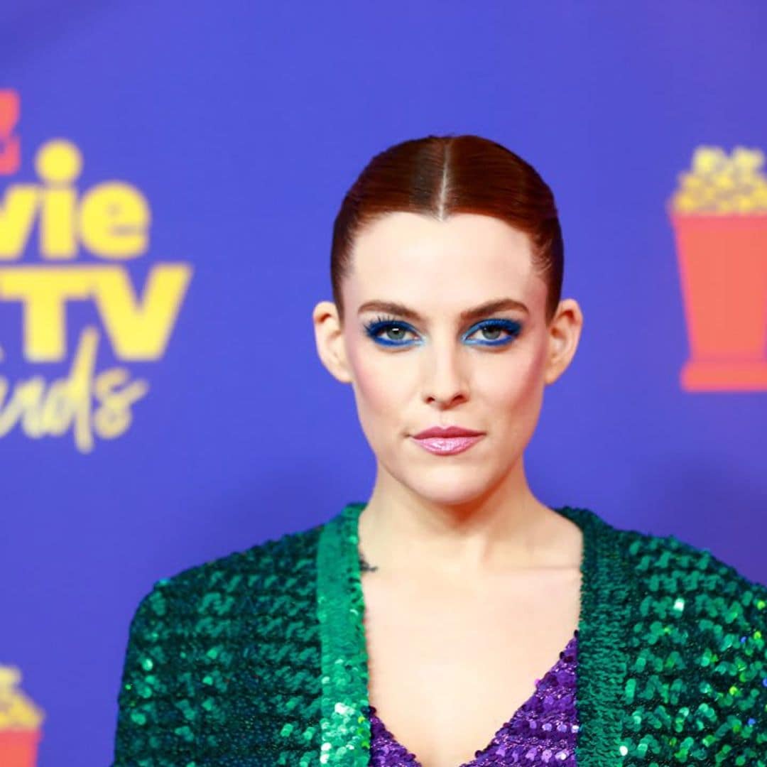 Riley Keough, daughter of Lisa Marie Presley, posed in a plunging gown in her bathroom