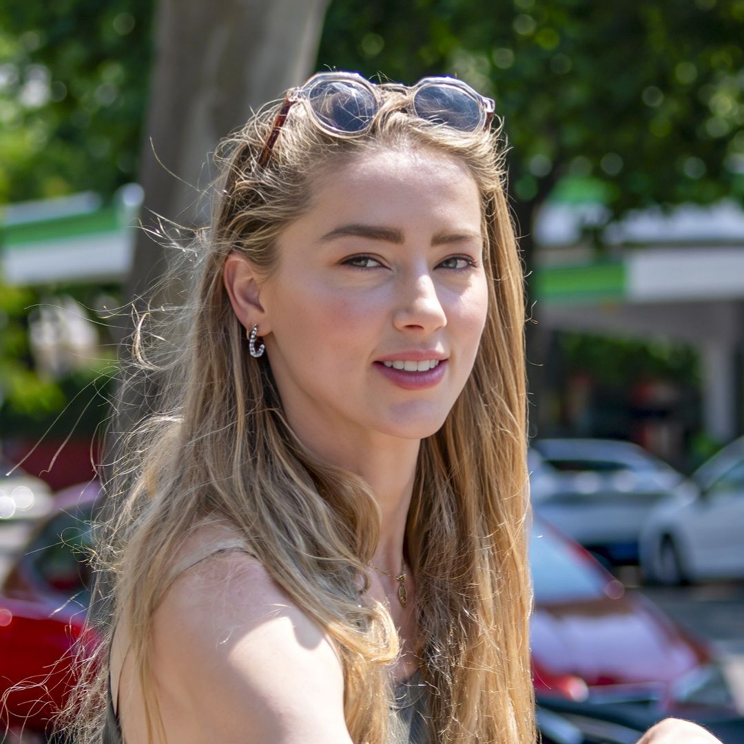 Amber Heard all smiles as she enjoys bike ride with daughter in Madrid amid new life chapter