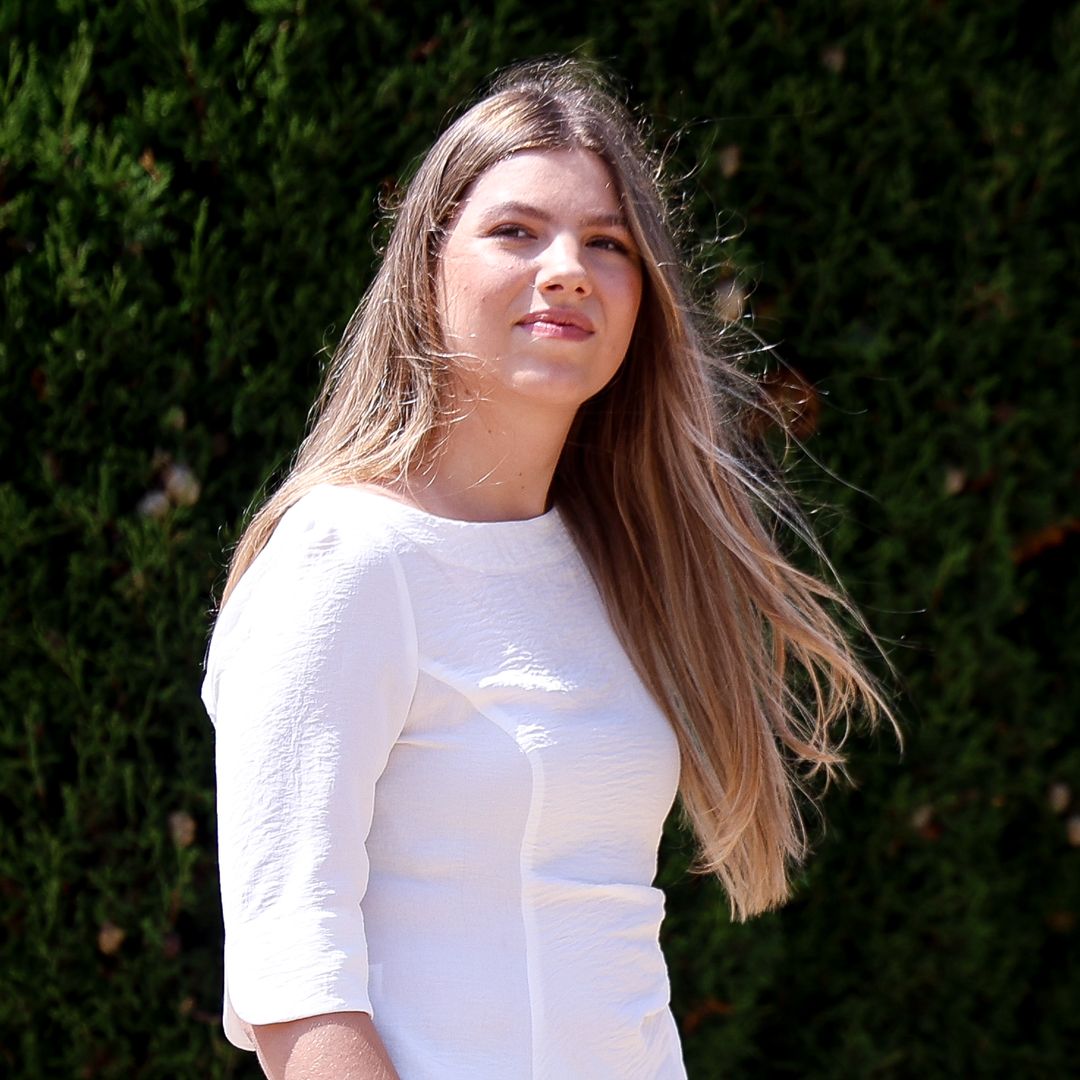 The Princess wore a muted outfit made up of white and light blue
