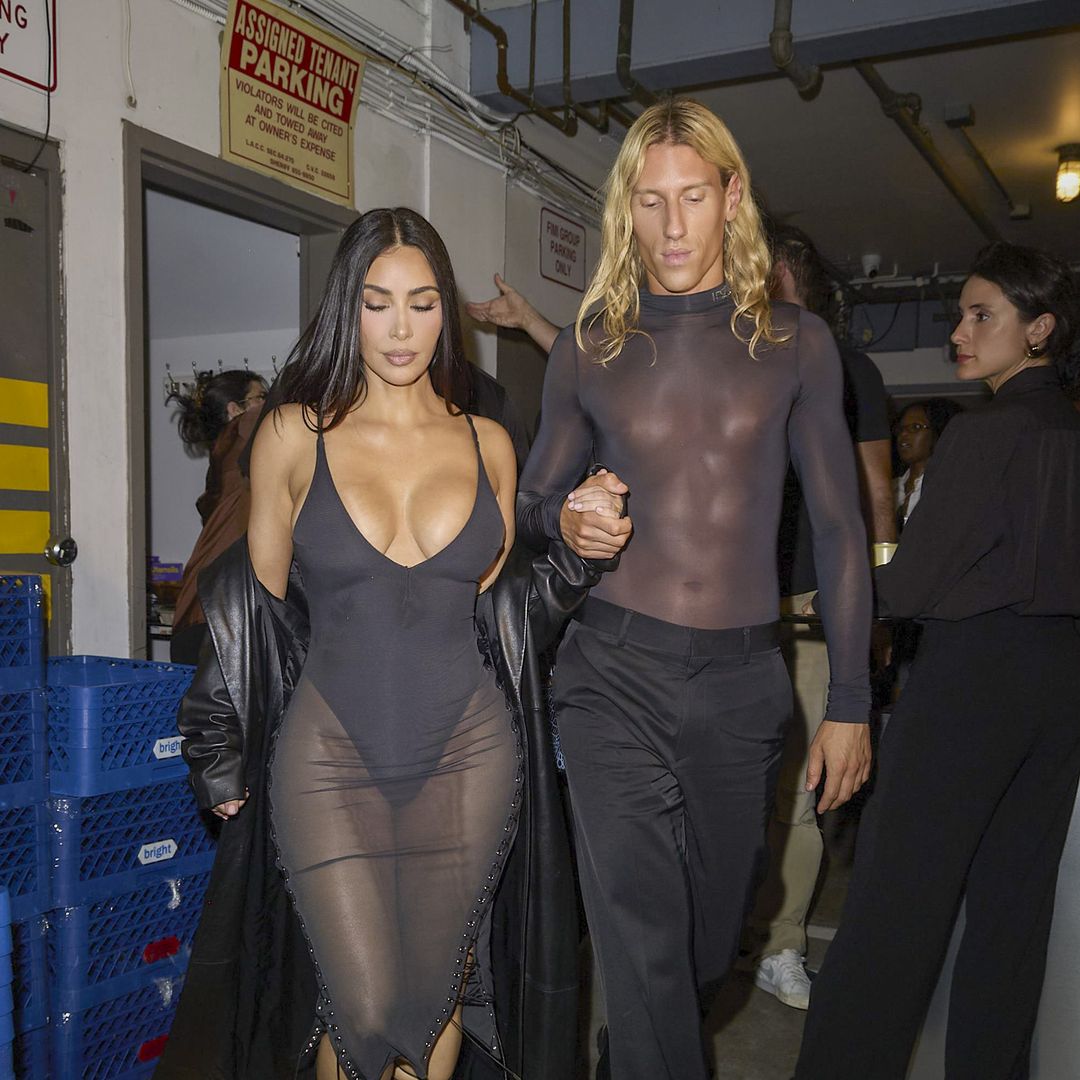 Kim Kardashian shocks while wearing deep cleavage and holding hands with Ludovic de Saint Sernin