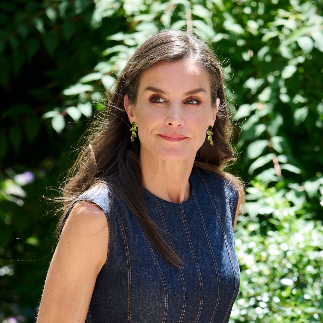 Queen Letizia rocks denim dress and bold red heels in Barcelona