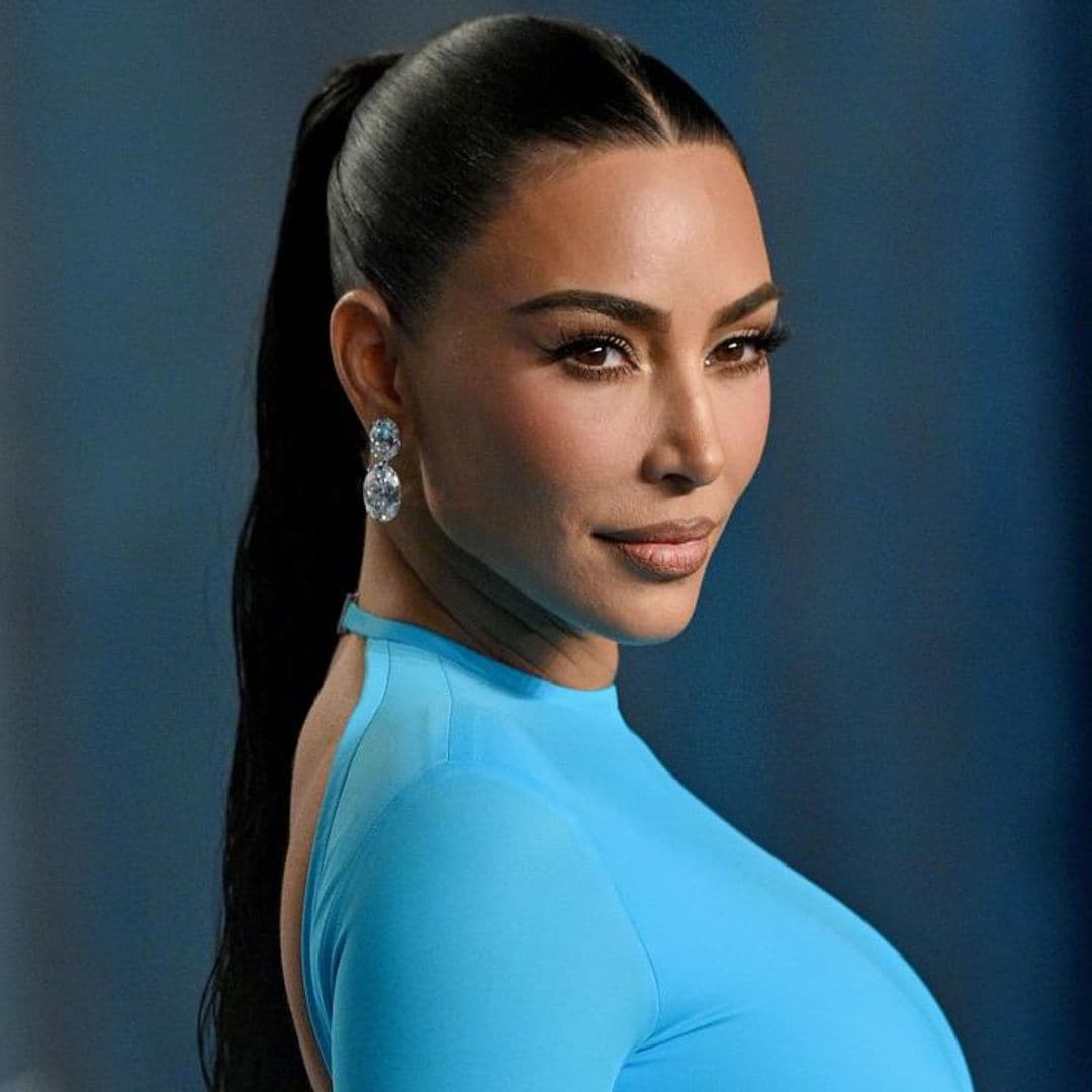 Kim Kardashian swaps her normal neutral tones for a bright blue gown at Vanity Fair Oscar party