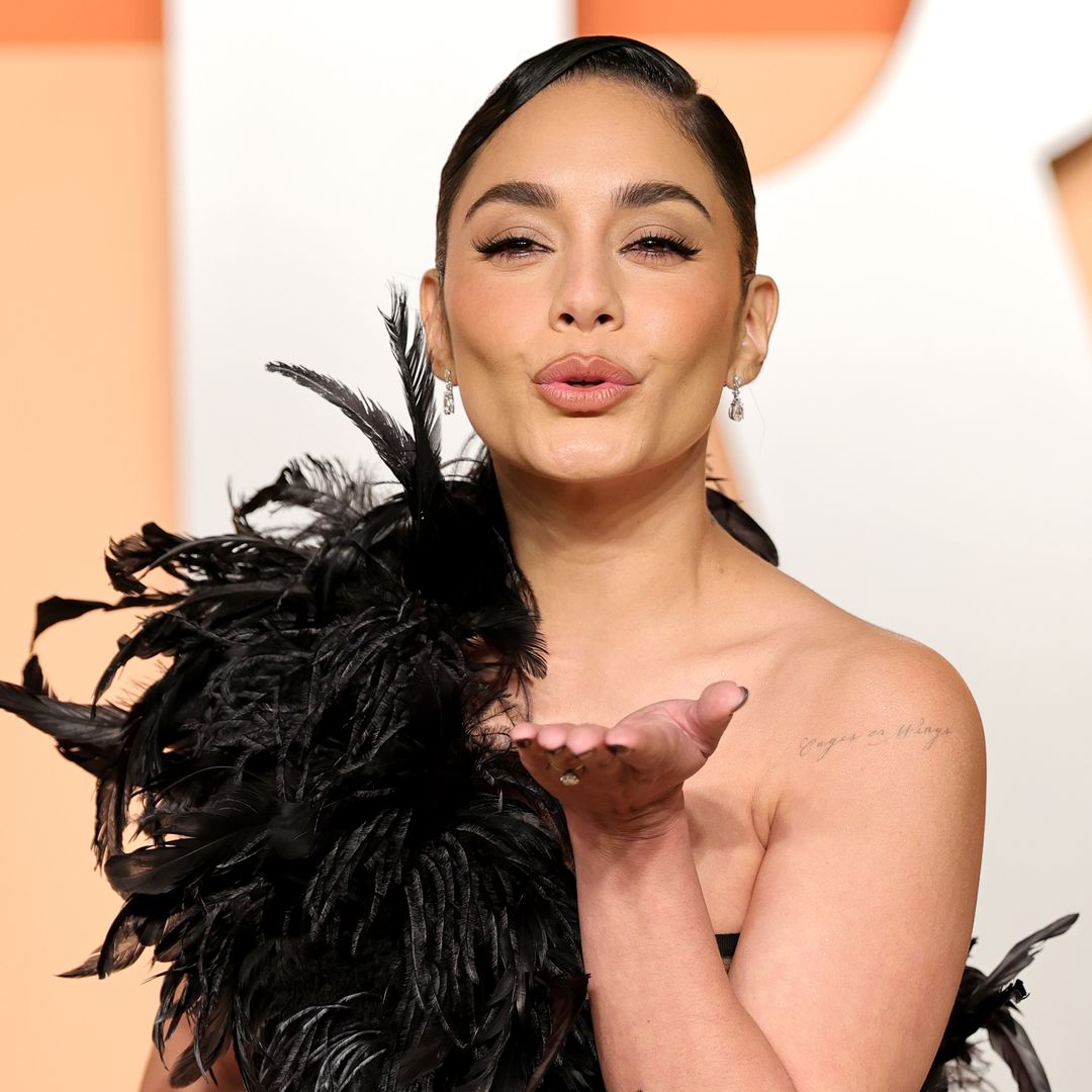 Vanessa Hudgens bares her baby bump in a sheer maternity dress