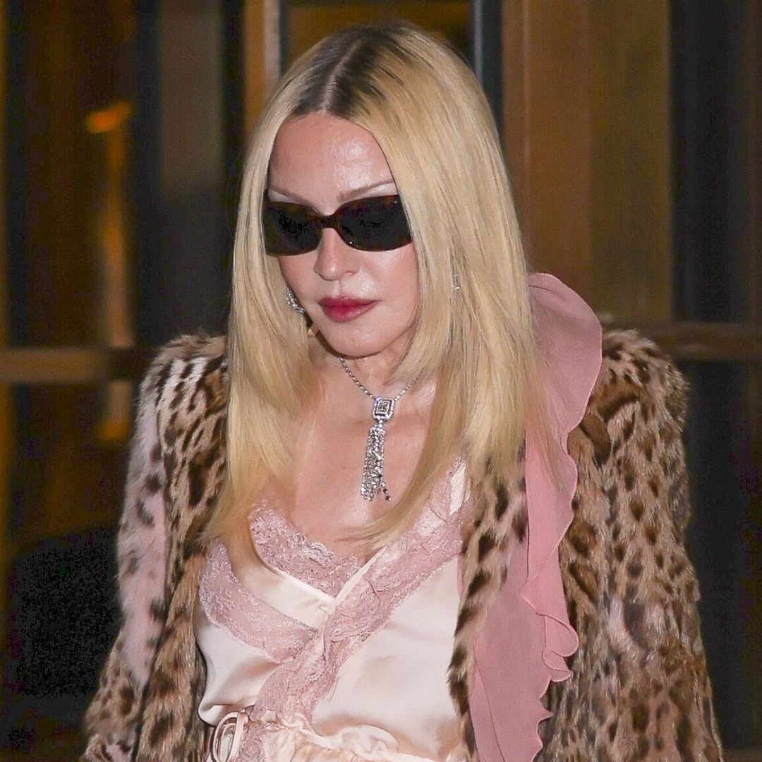 Madonna turns heads in leopard print, lace, and towering boots at Paris Fashion Week