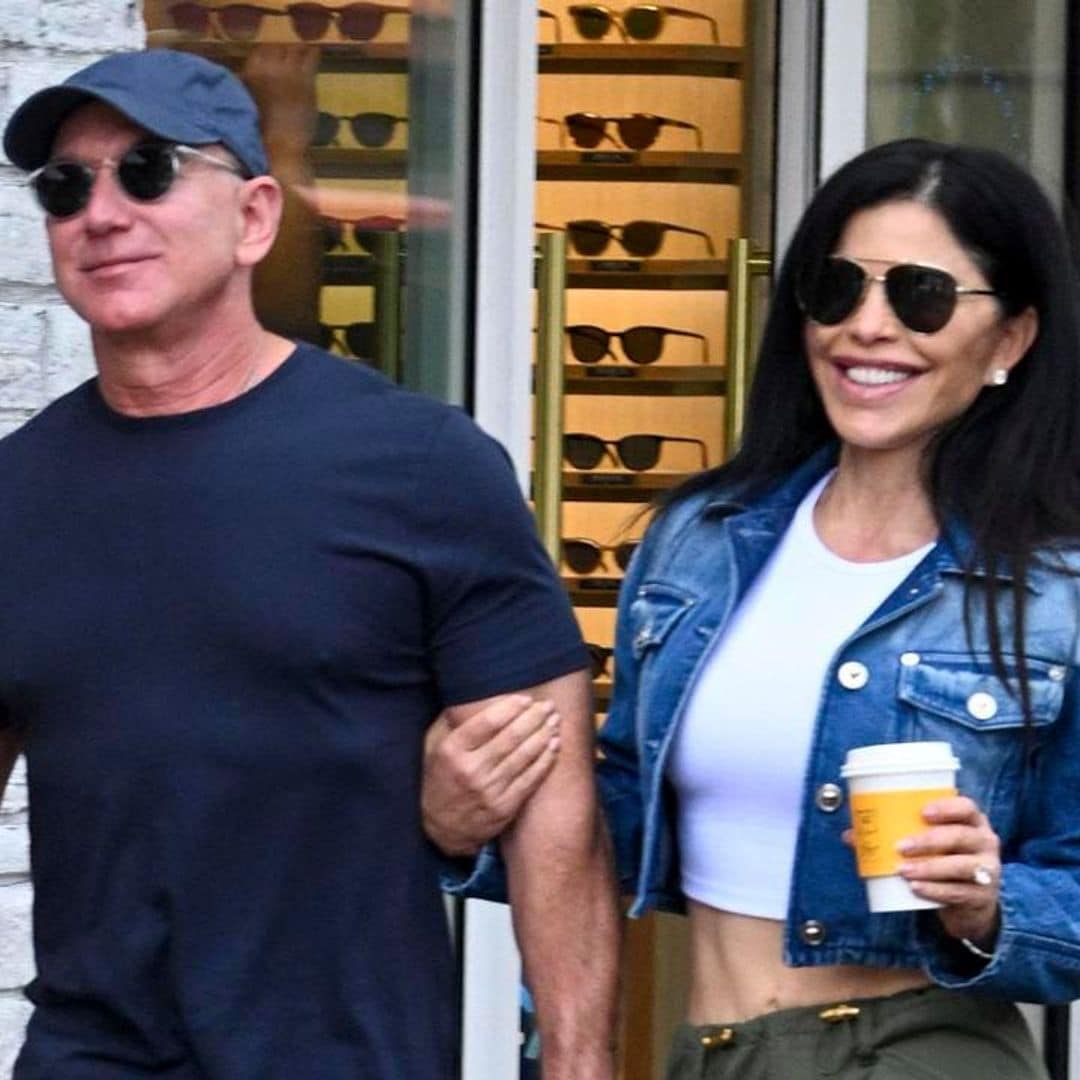 Jeff Bezos and Lauren Sanchez smile and hold on to each other at an art festival in Miami