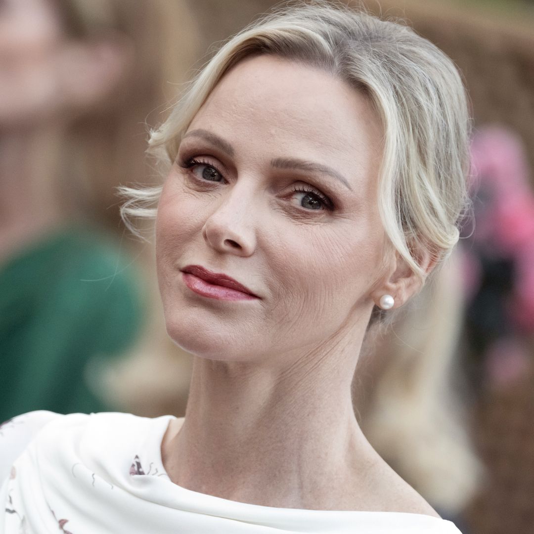 Princess Charlene channels Grace Kelly with a chic hairstyle and a modern power suit