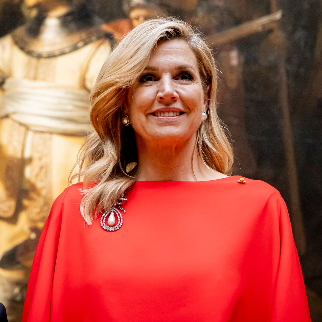 Máxima stuns in red for an engagement with Japan’s Emperor, reviving an antique pearl and diamond brooch