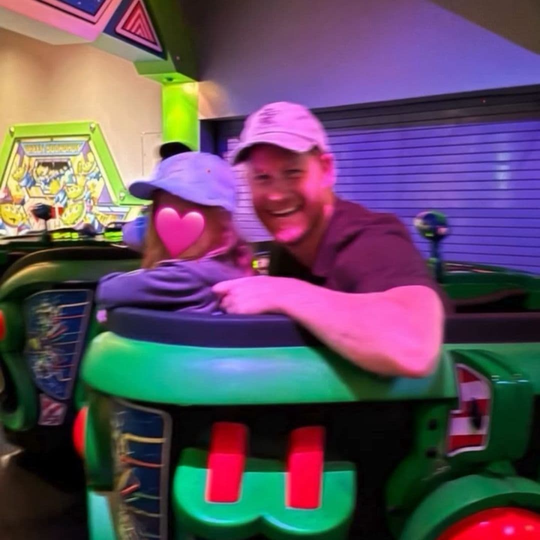 Prince Harry was all smiles riding Buzz Lightyear Astro Blasters with his little girl