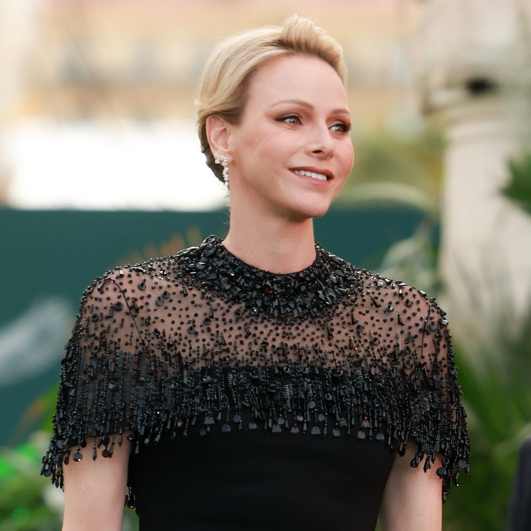 Princess Charlene wears a romantic white dress to meet the baby who made Monaco history