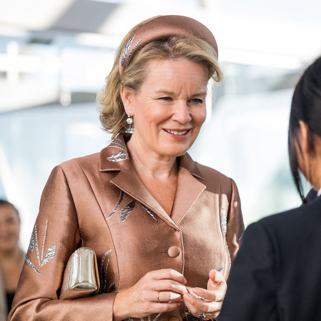 Queen Mathilde makes a statement in powder blue with an unexpected detail on her dress