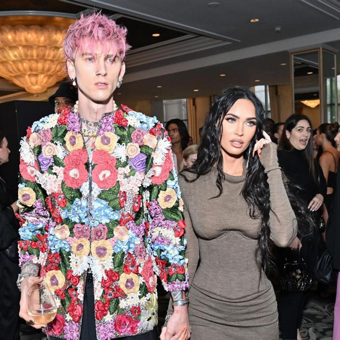 Megan Fox ducks away from Machine Gun Kelly’s kisses in awkward red carpet moment