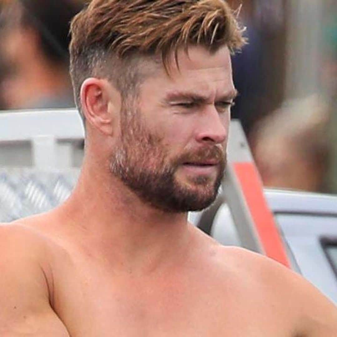Chris Hemsworth shows off his incredible physique while surfing in Byron Bay