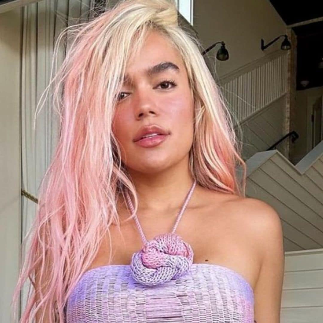 Karol G shows off her incredible figure by turning chic scarf into a top