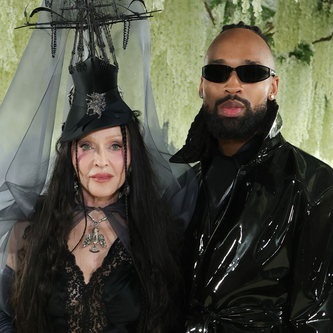 Madonna and boyfriend Akeem Morris look bundled up and in love at JFK Airport