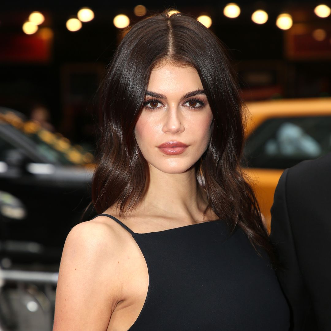 Kaia Gerber shares playful topless photo and festive lace look for Christmas