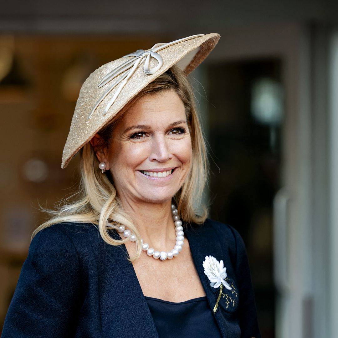 Máxima of the Netherlands channels Princess Diana with a daring red-and-purple ensemble