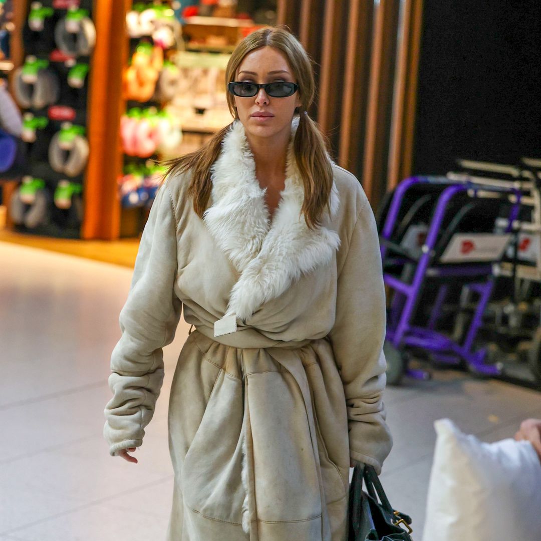 Bianca Censori was spotted wrapped in a bathrobe while wearing playful ponytails and holding the biggest Hermès bag ever created