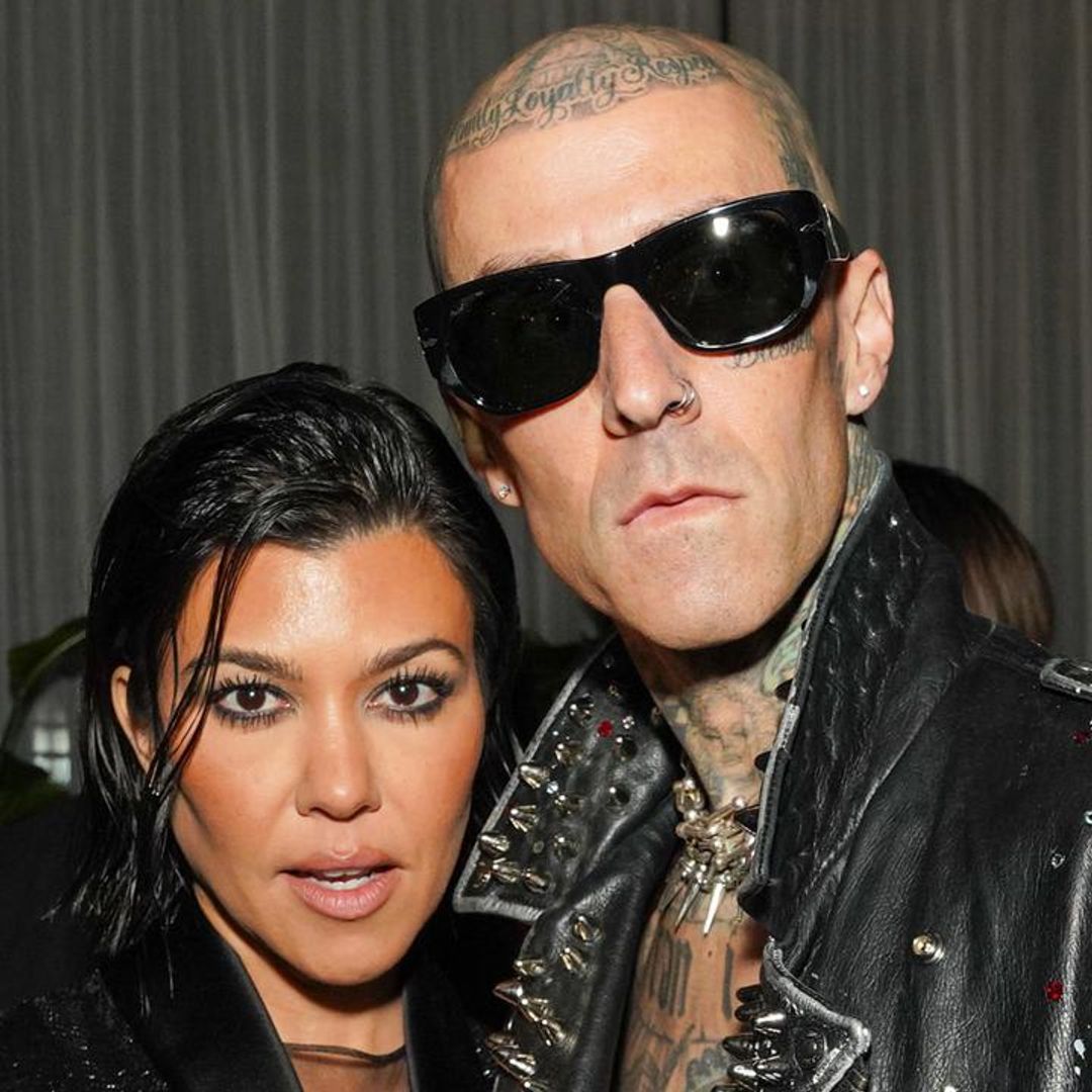 Kourtney Kardashian shows off her baby bump in an itty bitty red bikini