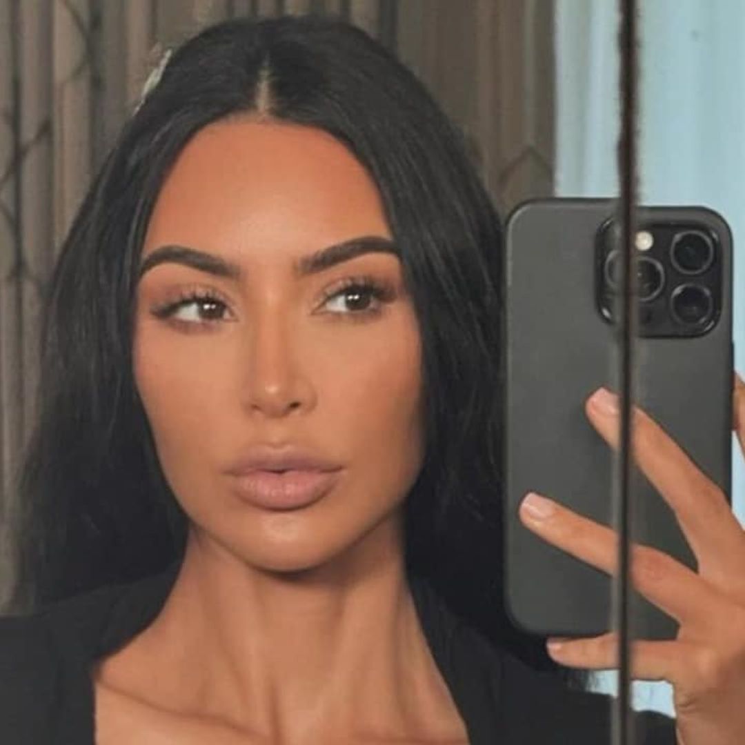 Kim Kardashian turns up the heat in black cut-out bikini and gold jewelry