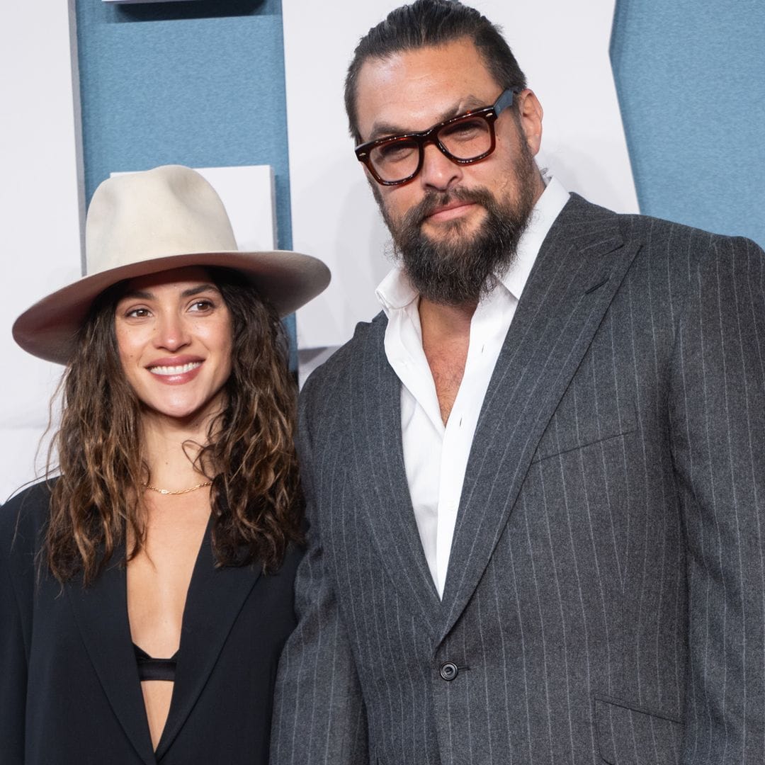 Adria Arjona takes the wheel with Jason Momoa ahead of their getaway— is it an anniversary trip?